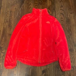 Orange fuzzy north face zip up jacket